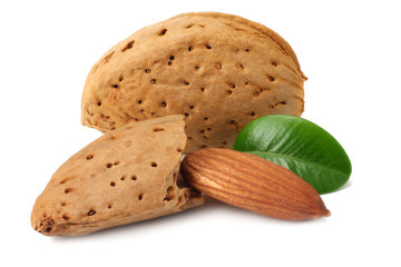 almond with green leaves isolated on white background