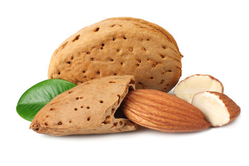 almond with green leaves isolated on white background