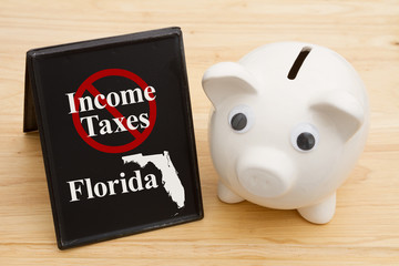 No income tax in the state of Florida message with a piggy bank