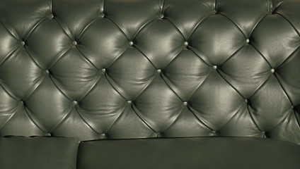 Green leather couch upholstery background