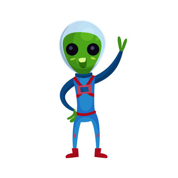 Funny green alien with big eyes wearing blue space suit waving his hand, alien positive character cartoon vector Illustration
