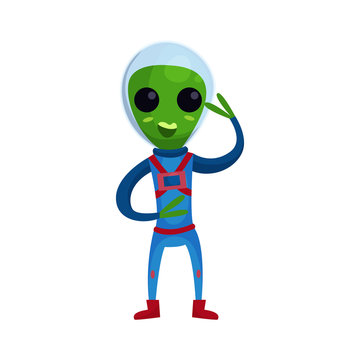 Friendly smiling green alien with big eyes wearing blue space suit waving his hand, alien positive character cartoon vector Illustration