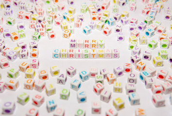 Conceptual of Merry Christmas Words made with Colorful Alphabetical Beads