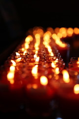 Rows of Votive Candles in Glass, Sacrifices for the Gods, Blurred of candles, Red Candle is kindle a fire in glass, Abstract Meaning of Religions