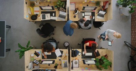 young productive business people working in office multitasking employees networking developing creative ideas for successful startup company using technology overhead