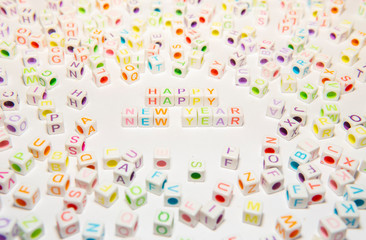 Conceptual of Happy New Year Words made with Colorful Alphabetical Beads