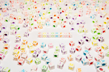 Fototapeta na wymiar Conceptual of Colorful Words made with Colorful Alphabetical Beads