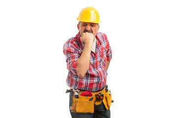 Construction worker showing fist as angry gesture.