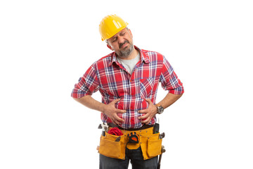 Constructor holding hands on bloated stomach.