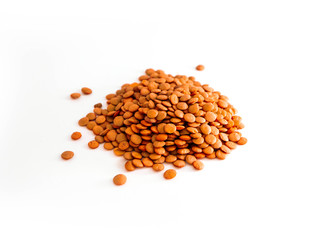 A pile of red lentil grains, isolated on white background.