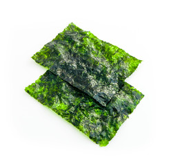 Two roasted sheets of seaweed, isolated on white background. Asian healthy dry nori snack food.