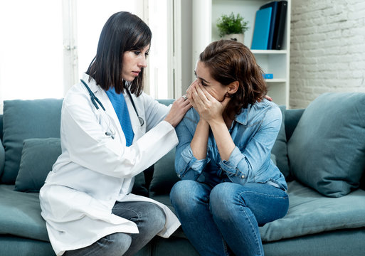 Woman Patient Receiving Bad News. Friendly Doctor Comforting And Support Sad Patient With Empathy