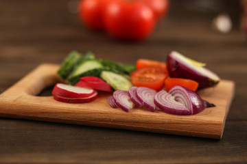 salad from fresh vegetables (tomato, cucumber, radish, pepper, arugula and other vegetables). copy space. top