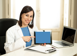 Smiling woman Doctor specialist having consultation using digital tablet to inform patient