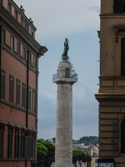 Fototapeta na wymiar Trajan's Column (Italian Colonna Traiana), a Roman triumphal column in Rome, Italy, commemorating Roman emperor Trajan's victory in the Dacian Wars