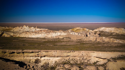 Panorama view to Aral sea from the rim of Plateau Ustyurt at sunset , Karakalpakstan, Uzbekistan