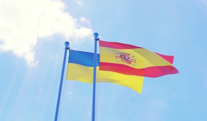 Ukraine and Spain, two flags waving against blue sky. 3d image