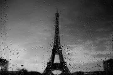 Paris Eiffel Tower through window at rainy day
