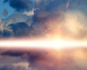 Amazing sunset picture with clouds, against sun rays reflected on the water surface.