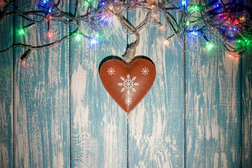 Christmas toys lie on a blue wooden background 