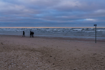 Fototapeta na wymiar Wind and snow clouds over the Gulf of Riga in December.