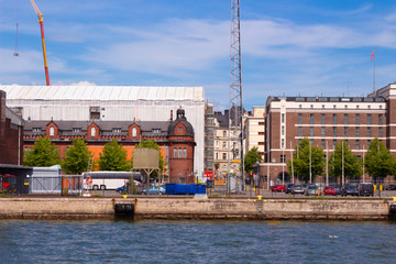 Embankment in the city of Helsinki with old historic and new modern buildings in the capital of...