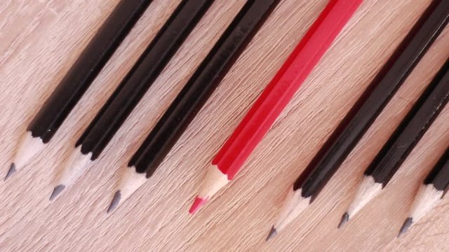 Single red and six black pencils