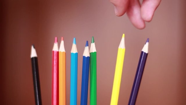 Taking colorful pencil closeup