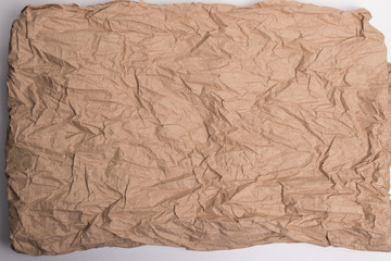 Crumpled paper background. Texture, background of brown crumpled paper.