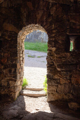 Stone granite ancient walls, dark rooms and archways in the historic Suomenlinna Fort Sveaborg in Finland on a summer day.