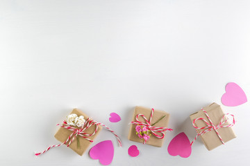 Hand-made pink love hearts and Gift box isolated on white wooden texture background, Happy valentine's day. holiday background, Flat lay, top view, copy space
