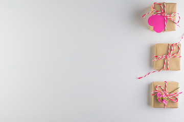 Hand-made pink love hearts and Gift box isolated on white wooden texture background, Happy valentine's day. holiday background, Flat lay, top view, copy space