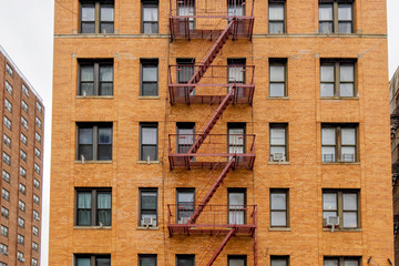 Obraz premium New-York building facades with fire escape stairs