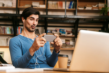 Handsome confident young man wearing glasses