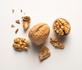 a whole walnut, an open walnut and other pieces
