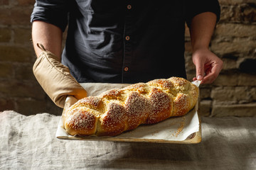 Raw challah traditional jewish bread covered with linen towel. Steps food concept.