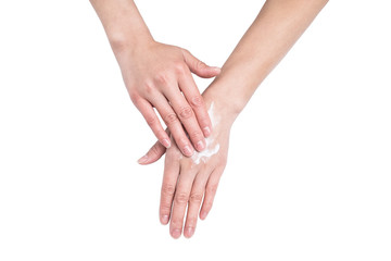 Asian women's hands rubbing hand cream