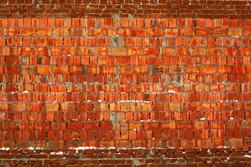 Old aged cracked red bricks wall