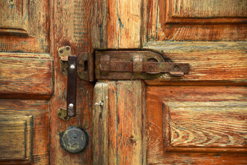 Old lock on wooden door