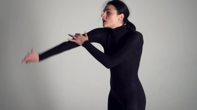 Beautiful woman freestyle dancing in studio