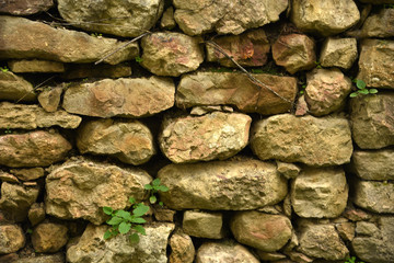 Decorative wall of stones in the mountains
