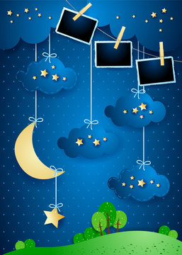 Surreal landscape with crescent moon, hanging stars and photo frames