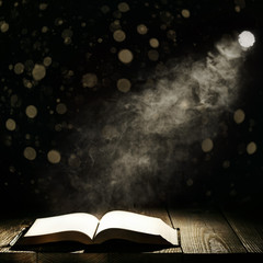 a book against a moonlight night city