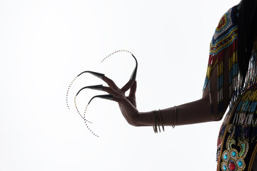 Shadow of Asian woman in traditional costume of Southern Thailand. Nora dance show.