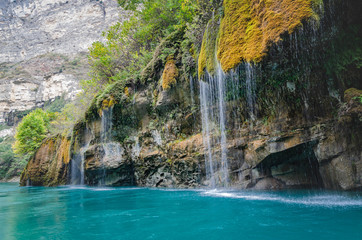 Fototapeta na wymiar canyon with blue river and waterfalls