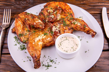 Chicken with garlick sauce and greens