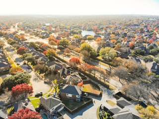 Top view colorful lakeside urban sprawl residential area near Dallas in autumn season