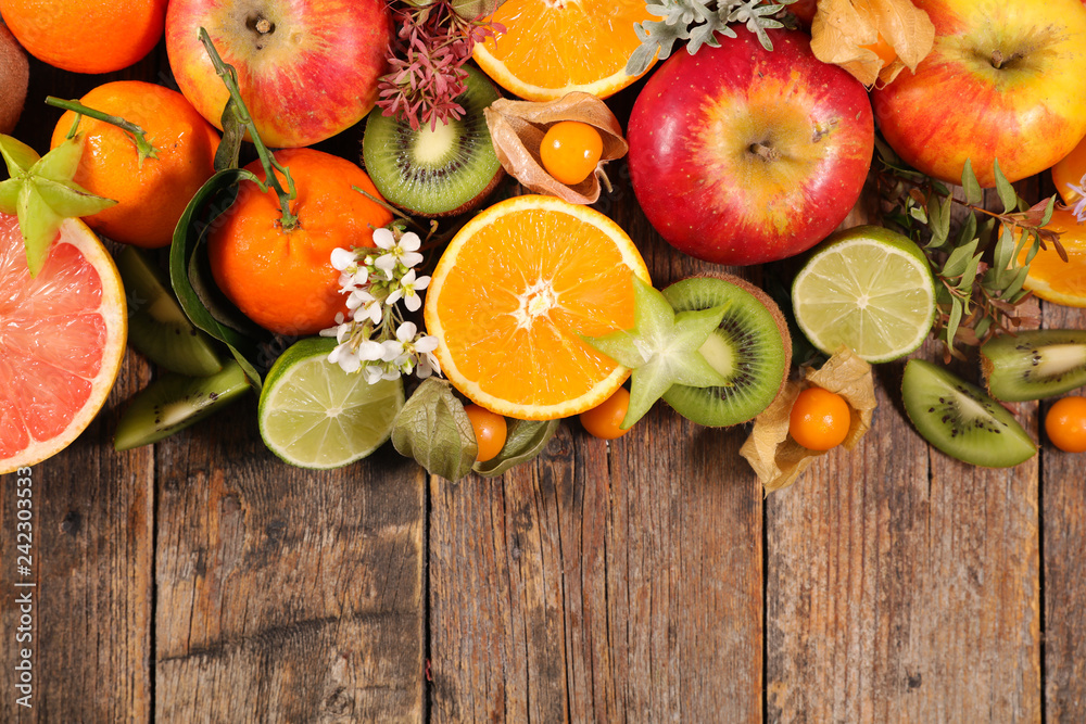 Poster assorted fruit on wood background