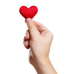 Hand holding a red small heart, isolated on white background