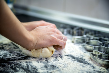The process of kneading dough for cookies.